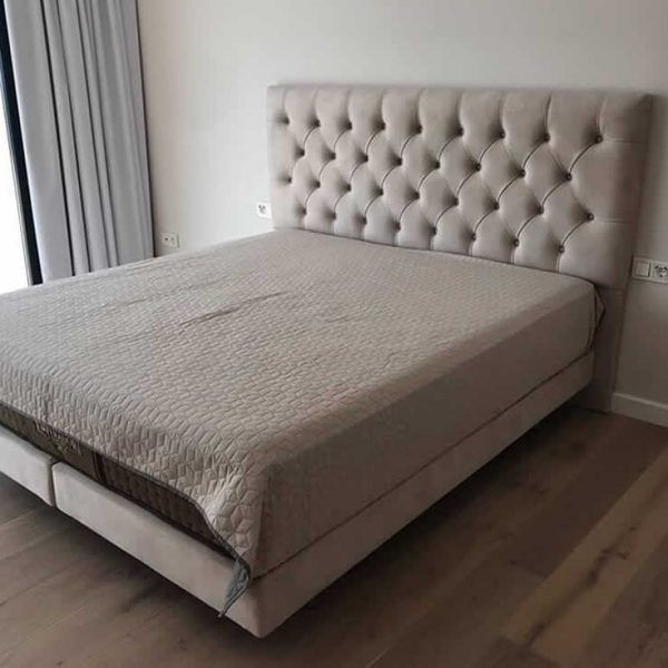 dormitorio matrimonio moderno cama tapizada capitone descanso